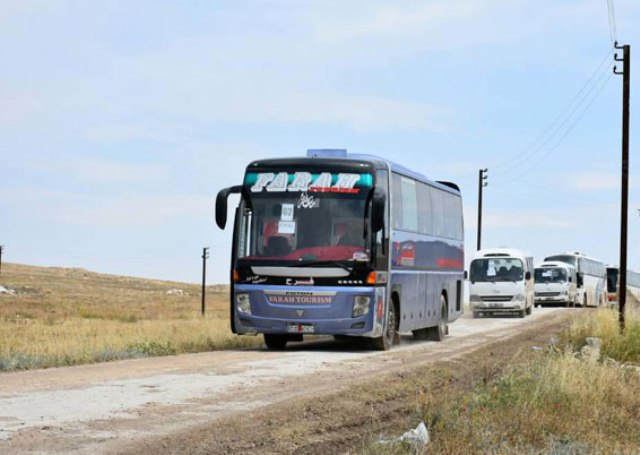 تجهيز 70 حافلة لإخراج دفعة جديدة من الإرهابيين وعائلاتهم من ريفي حمص الشمالي وحماة الجنوبي إلى شمال سورية