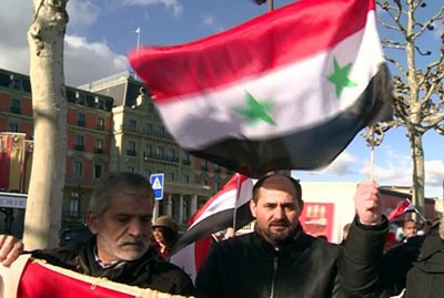 مسيرة للجالية السورية في جنيف دعما للوفد الرسمي السوري وتأكيدا على سيادة سورية ورفض التدخل الخارجي
