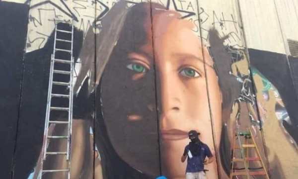 إسرائيل تعتقل رسامين إيطاليين بسبب رسمة جدارية لعهد التميمي